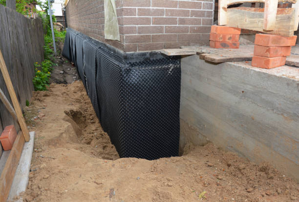 SJ Waterproofing Pros technician performing targeted Waterproofing assessment in Monroe, GA
